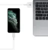 A smartphone is connected to a laptop via a USB cable. Produktbild-Vorschau