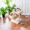Two cats playing on a cat tree in a room with plants. Produktbild-Vorschau