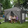 People are having a meal under a gray canopy in a backyard. Produktbild-Vorschau
