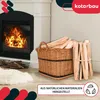 A fireplace with a basket of firewood next to it, with a rug in the foreground. Voir les images du produit