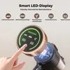 A hand is touching the LED display of a cordless vacuum cleaner, showing its features and status indicators. Produktbild-Vorschau
