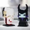 Two LEGO BrickHeadz figures, Cruella and Maleficent, are displayed side-by-side on a light gray surface. Anteprima dell’immagine prodotto