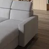A close-up view of a gray sofa armrest and headrest, with a wooden floor in the background. Produktbild-Vorschau