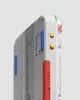 A close-up, side view of a white mechanical keyboard with red, blue, and yellow accents. Produktbild-Vorschau