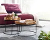 A living room setting with a couch and two nesting coffee tables. Voir les images du produit