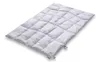 A white down comforter is laid out on a white background. Produktbild-Vorschau