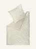 A duvet cover and pillowcase with a geometric pattern are laid out flat on a light beige background. Anteprima dell’immagine prodotto