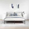 A bedroom scene with a bed, nightstands, and artwork. Náhled obrázku produktu
