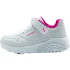 A side view of a white Skechers sneaker with pink accents. Voir les images du produit