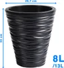 A dark gray planter with a wavy texture is shown against a white background. Dimensions and capacity are indicated with text and arrows. Voir les images du produit