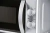 Close-up of the control panel and door of a microwave oven. Produktbild-Vorschau