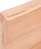 Close-up view of a light-colored wooden table edge with visible wood grain. Produktbild-Vorschau