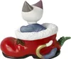 A ceramic figurine of a cat sitting in a red boot. Anteprima dell’immagine prodotto