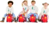 Four children are sitting on red ride-on suitcases, smiling at the camera. Produktbild-Vorschau