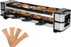 A raclette grill with food on it and wooden spatulas in the foreground. Anteprima dell’immagine prodotto