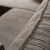 A close-up view of the textured fabric of a sofa, showing the stitching and ribbed pattern. Produktbild-Vorschau
