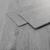 Two vinyl flooring planks are shown on a matching floor. Podgląd zdjęcia produktu