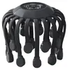 A dark gray octopus-like head massager is displayed against a white background. Produktbild-Vorschau