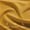 A close-up of yellow fabric with icons and text describing its features. Produktbild-Vorschau