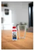 A bottle of cleaning product and a glass vase on a wooden table. Produktbild-Vorschau