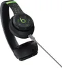 A pair of black Beats By Dre Solo 4 headphones with green pixelated accents and a charging cable plugged in, set against a white background. Produktbild-Vorschau