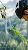A climber wearing a helmet and safety gear on a mountain. Podgląd zdjęcia produktu