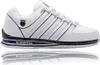 A white K-Swiss shoe with blue accents and its sole reflected below. Produktbild-Vorschau