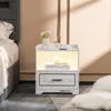 A bedside table with LED lighting and USB ports next to a bed. Produktbild-Vorschau