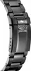 A close-up shot of a black metal watch band and clasp, featuring the Jaguar logo and brand name. Produktbild-Vorschau