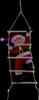 A Santa Claus figure climbing a rope ladder decorated with colorful LED lights against a black background. Podgląd zdjęcia produktu