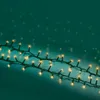 A string of LED lights on a dark teal background. Produktbild-Vorschau