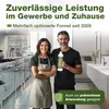 A man and a woman are standing in a kitchen setting, holding a bottle of cleaning product. The background shows kitchen appliances and a bathroom sink area. Produktbild-Vorschau