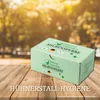 A product box is placed on a wooden table with a blurred background of trees and sunlight. Produktbild-Vorschau