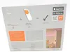 The back of a product box showing a diagram of how the LED strip connects to a smartphone app for smart home control. Podgląd zdjęcia produktu
