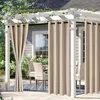 Outdoor curtains hanging on a pergola over a patio with chairs and a table. Náhled obrázku produktu