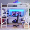 A loft bed with a desk and gaming setup, featuring colorful LED lighting. Produktbild-Vorschau