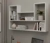 A white wall-mounted shelf unit with books, a plant, and decorative items. Voir les images du produit