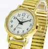A close-up studio shot of a gold-toned analog watch with a white face and a flexible metal band. Produktbild-Vorschau