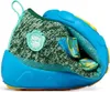 A close-up, studio shot of a child's shoe, bent to show the interior. Voir les images du produit