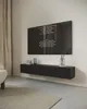 A modern living room with a wall-mounted TV board and a large TV displaying credits. Produktbild-Vorschau