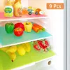Inside a refrigerator, showing various fruits, vegetables, and bottles on colorful shelf liners. Produktbild-Vorschau
