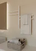 A modern bathroom scene with a white towel warmer, towels, and toiletries on a countertop. Podgląd zdjęcia produktu