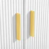 A close-up view of two gold handles on a white ribbed cabinet. Produktbild-Vorschau