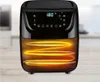 A black air fryer is shown on a wooden table with a blurred kitchen background. The heating element inside the air fryer is glowing orange. Produktbild-Vorschau