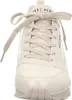 A close-up front view of a beige Skechers sneaker. Voir les images du produit