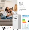 A family is happily sitting on a couch in a living room, with a portable air conditioner unit in the foreground. Produktbild-Vorschau