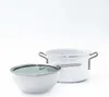 A white pot and a white bowl with a glass lid are shown against a white background. Anteprima dell’immagine prodotto