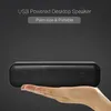 A hand holding a small black speaker with text overlays. Produktbild-Vorschau