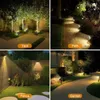 A collage of four images showing different outdoor lighting scenarios for yards, paths, fences, and gardens. Anteprima dell’immagine prodotto