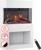 A white electric fireplace with a glass front showing a realistic flame effect and glowing logs. It has a shelf below and icons indicating features on the left. A remote control is shown on the right. Náhľad obrázku produktu